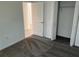 Well-lit bedroom with carpeted floors and a large closet at 1274 Fury St, Davenport, FL 33837