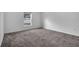 Simple bedroom with carpet flooring and a window at 1274 Fury St, Davenport, FL 33837