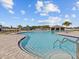 Resort-style pool with spacious deck and shaded seating areas at 1274 Fury St, Davenport, FL 33837