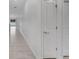 Clean hallway with tiled floors and white walls at 1274 Fury St, Davenport, FL 33837