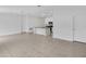 Modern kitchen with white cabinets, island, and stainless steel appliances at 1274 Fury St, Davenport, FL 33837