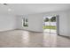 Spacious living room with tile floors and sliding glass doors to backyard at 1274 Fury St, Davenport, FL 33837