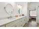 Modern bathroom with double vanity and a view to the bedroom at 1308 Grady Ln, Davenport, FL 33896