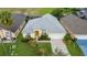Single-Gathering house with a gray roof and a well-maintained lawn at 135 Langham Dr, Davenport, FL 33897