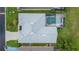 House with a swimming pool and surrounding landscaping at 135 Langham Dr, Davenport, FL 33897