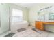 Bathroom with soaking tub, shower, and double vanity at 135 Langham Dr, Davenport, FL 33897