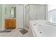 Large bathroom with soaking tub, shower, and separate vanity at 135 Langham Dr, Davenport, FL 33897