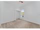 Simple bedroom with neutral walls and carpeted floor at 135 Langham Dr, Davenport, FL 33897