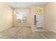 Bright dining room with large window and neutral carpeting at 135 Langham Dr, Davenport, FL 33897