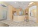 Kitchen with light wood cabinets and breakfast bar at 135 Langham Dr, Davenport, FL 33897