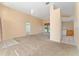 Open living room with access to kitchen and dining areas at 135 Langham Dr, Davenport, FL 33897