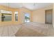 Living room with sliding glass doors opening to a pool and patio at 135 Langham Dr, Davenport, FL 33897