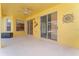 Covered patio with sliding glass doors leading to the pool at 135 Langham Dr, Davenport, FL 33897