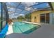 Enjoy this refreshing pool with a screened enclosure at 135 Langham Dr, Davenport, FL 33897