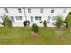 Aerial view showing multiple townhouses and green space at 1481 Discovery St, Davenport, FL 33896