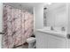 Clean bathroom with white vanity and updated shower at 1481 Discovery St, Davenport, FL 33896