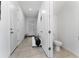 Clean bathroom with white cabinets, double vanity, and a walk-in shower at 1481 Discovery St, Davenport, FL 33896