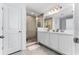 Main bathroom with double vanity and a large walk-in shower at 1481 Discovery St, Davenport, FL 33896