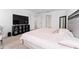 Main bedroom with king bed, TV, and neutral decor at 1481 Discovery St, Davenport, FL 33896