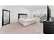 Main bedroom with king-size bed, large mirror, and neutral carpeting at 1481 Discovery St, Davenport, FL 33896
