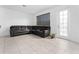 Spacious living room featuring a large sectional sofa and tile flooring at 1481 Discovery St, Davenport, FL 33896