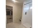 Bathroom with walk-in closet and shower at 1511 Woodmont Blvd, Kissimmee, FL 34746