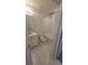 Clean bathroom with white vanity, tub, and gray tile flooring at 1511 Woodmont Blvd, Kissimmee, FL 34746
