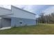 Two-story house with gray siding and small yard at 1511 Woodmont Blvd, Kissimmee, FL 34746