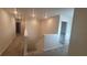 Upstairs hallway with carpet and access to bedrooms and bathroom at 1511 Woodmont Blvd, Kissimmee, FL 34746