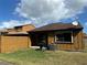Private backyard with wooden fence, grill, and patio at 156 Lakewood Village Cir # 156, Daytona Beach, FL 32119