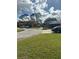 Community overview featuring manicured lawns and parking at 156 Lakewood Village Cir # 156, Daytona Beach, FL 32119