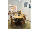 Charming dining room with a round table and four chairs at 156 Lakewood Village Cir # 156, Daytona Beach, FL 32119