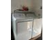 Laundry room with washer and dryer, and extra shelving at 156 Lakewood Village Cir # 156, Daytona Beach, FL 32119