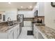 Bright kitchen featuring white cabinets and granite countertops at 161 Orange Cosmos Blvd, Davenport, FL 33837