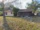 This home includes a large backyard with a screened in porch at 1823 Natchez Trace Blvd, Orlando, FL 32818