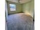 A carpeted bedroom that receives lots of natural light at 1823 Natchez Trace Blvd, Orlando, FL 32818