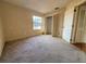 Bright bedroom featuring a neutral carpet, closet, and natural light from the window at 1823 Natchez Trace Blvd, Orlando, FL 32818