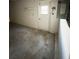 Spacious garage features block walls, concrete floor, and exterior access door at 1823 Natchez Trace Blvd, Orlando, FL 32818