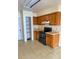Functional kitchen with black appliances, and tile flooring at 1823 Natchez Trace Blvd, Orlando, FL 32818