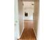 Open living room with hardwood floors and views into an adjacent room at 1823 Natchez Trace Blvd, Orlando, FL 32818