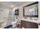 Clean bathroom with a walk-in shower and modern vanity at 212 Rontunda Dr, Kissimmee, FL 34758