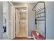 Bathroom features tiled shower and walls, with a hallway coat rack on the adjacent wall at 212 Rontunda Dr, Kissimmee, FL 34758