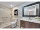 Bathroom featuring a spacious shower and a dark wood vanity with a white countertop at 212 Rontunda Dr, Kissimmee, FL 34758