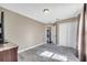 Bedroom with wood-look tile floors, neutral walls, a double door closet and ample natural light at 212 Rontunda Dr, Kissimmee, FL 34758