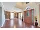 Welcoming foyer with high ceilings, beautiful front door with glass accents, and hardwood floors at 212 Rontunda Dr, Kissimmee, FL 34758