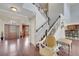 Spacious foyer boasts hardwood floors, a staircase, and decorative front door at 212 Rontunda Dr, Kissimmee, FL 34758
