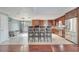 Bright kitchen featuring tile floors, stainless appliances and barstool seating at 212 Rontunda Dr, Kissimmee, FL 34758