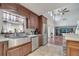 Bright kitchen features stainless steel appliances, granite countertops, and a large farmhouse sink at 212 Rontunda Dr, Kissimmee, FL 34758