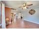 Open-concept living room with hardwood floors, plenty of space, and staircase to the second floor at 212 Rontunda Dr, Kissimmee, FL 34758