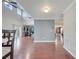 Open concept living room offers hardwood floors, neutral walls and access to backyard at 212 Rontunda Dr, Kissimmee, FL 34758